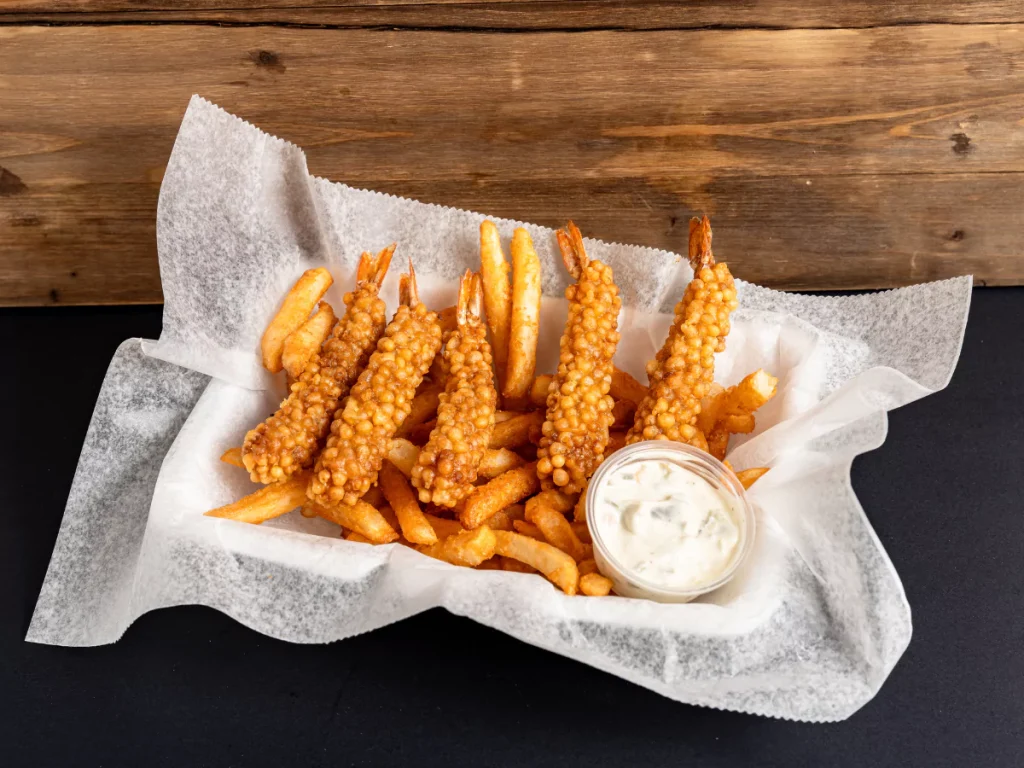 Crispy best loaded fries near Townewest with fried shrimp and creamy dipping sauce in a rustic basket