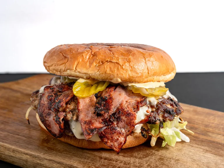 A close-up of a chef-inspired burger with specialty toppings like pastrami, a delicious option from the Local Burgers Near Sugar Land