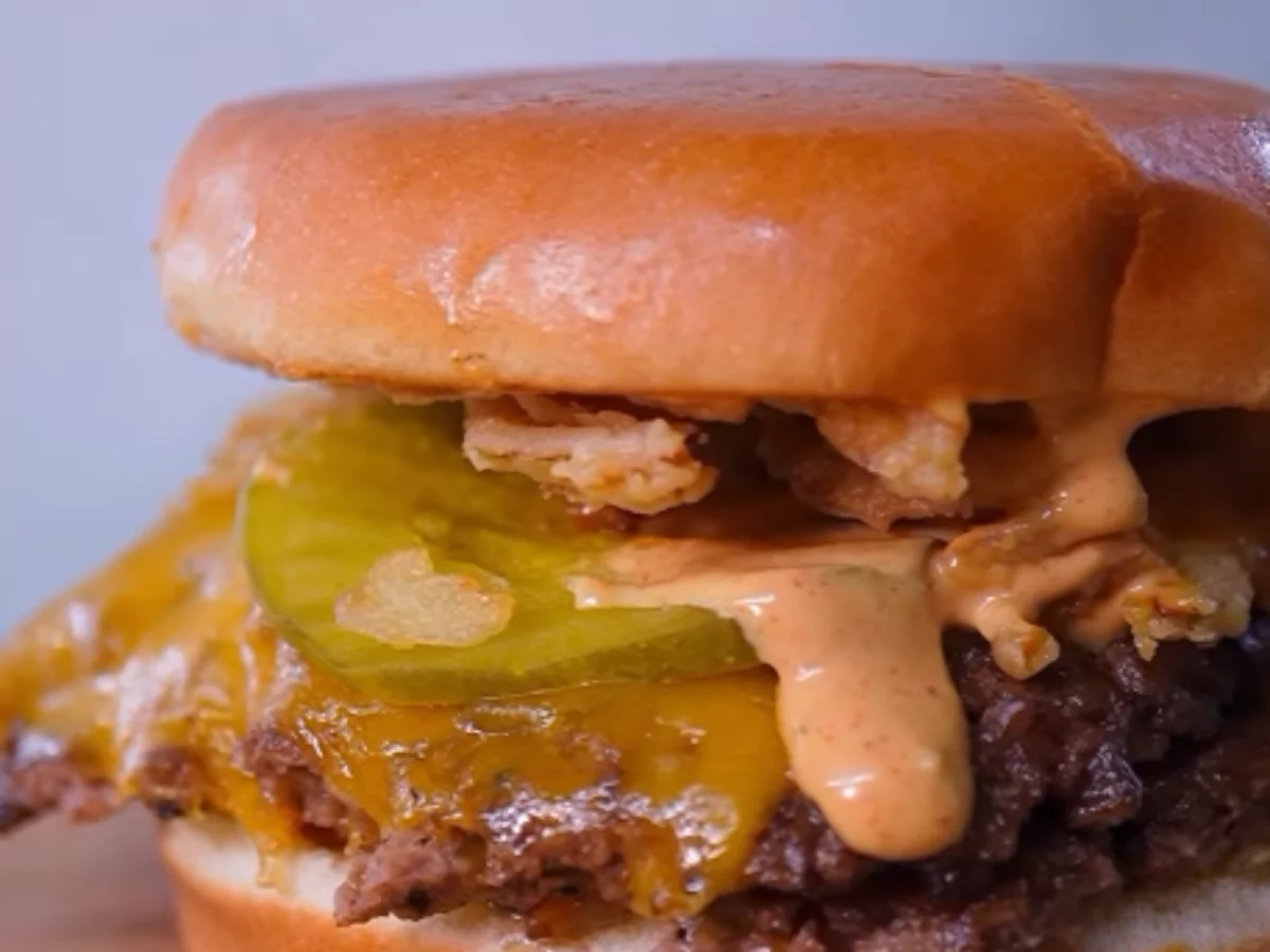 Tasty cheeseburger with pickles and sauce at a top family-friendly burger restaurants near Sugar Grove