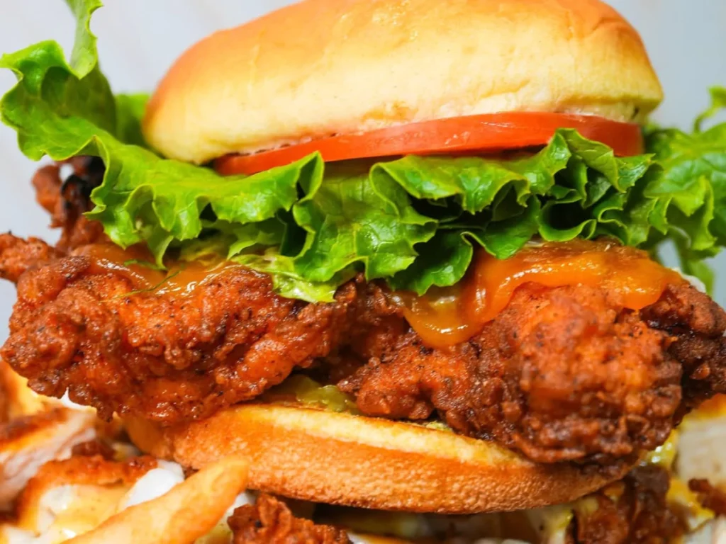 Crispy fried chicken sandwich with lettuce and tomato from one of the top burger spots in Waterford